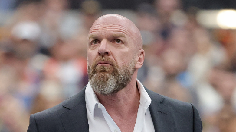 Triple H gazes up into the crowd