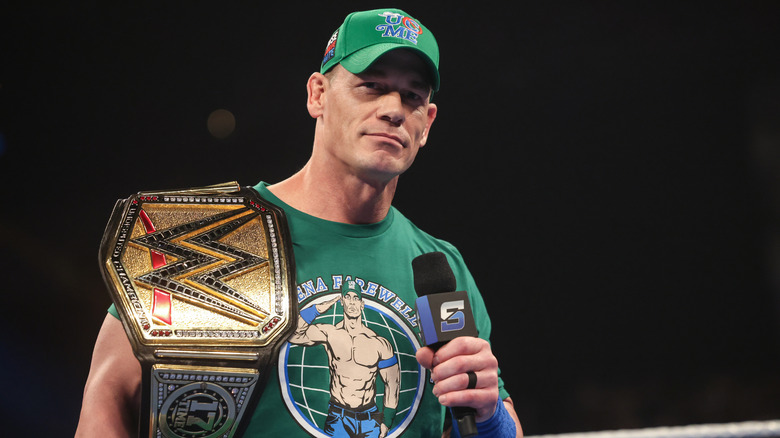 John Cena, with title belt on his shoulder