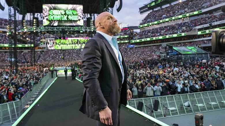 Triple H observing the crowd