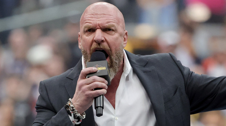 Triple H talking in the ring