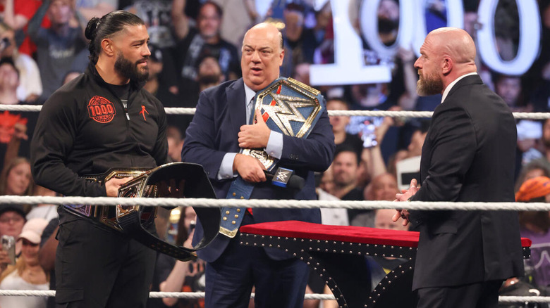 Roman Reigns, Paul Heyman, and Triple H