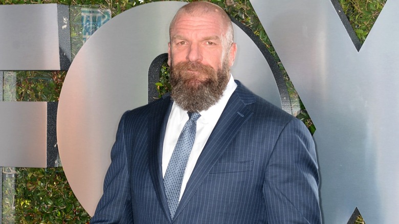 Triple H standing in front of a Fox backdrop