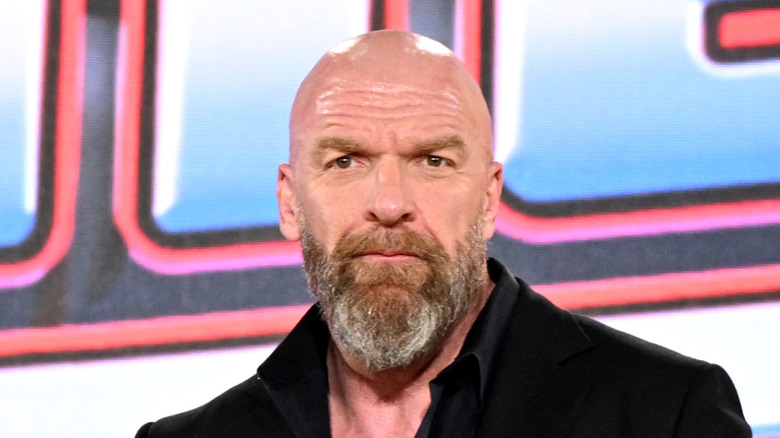 Triple H doing his best Dana White pose