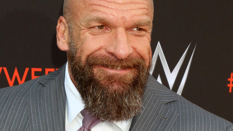 Triple H grinning