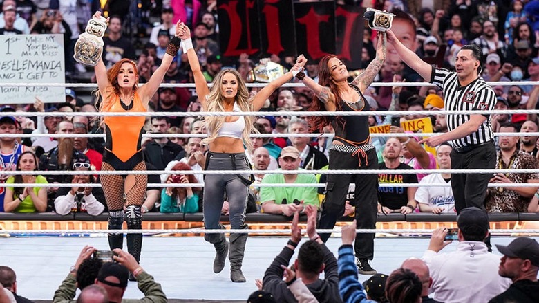 Becky Lynch, Trish Stratus, and Lita celebrate