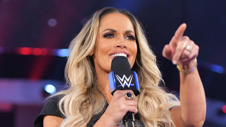 Trish Stratus speaking into a microphone while appearing for WWE