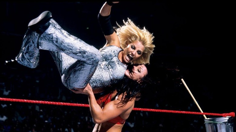 Trish Stratus attempts to hit her finisher the Stratusfaction on Victoria