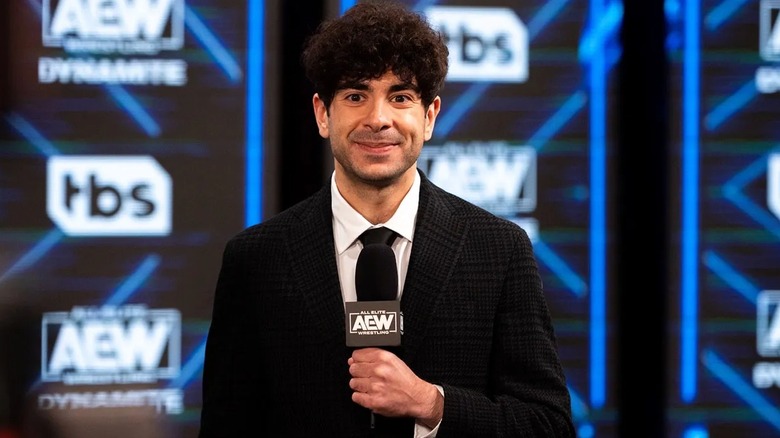 AEW President Tony Khan awaits to speak on an important message