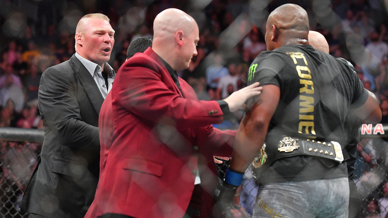 Brock Lesnar confronts Daniel Cormier in the Octagon