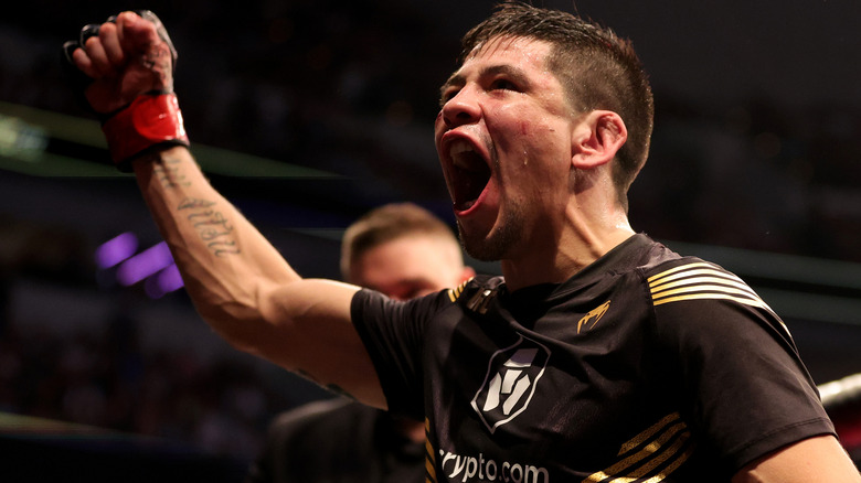 Brandon Moreno celebrates winning UFC Flyweight title