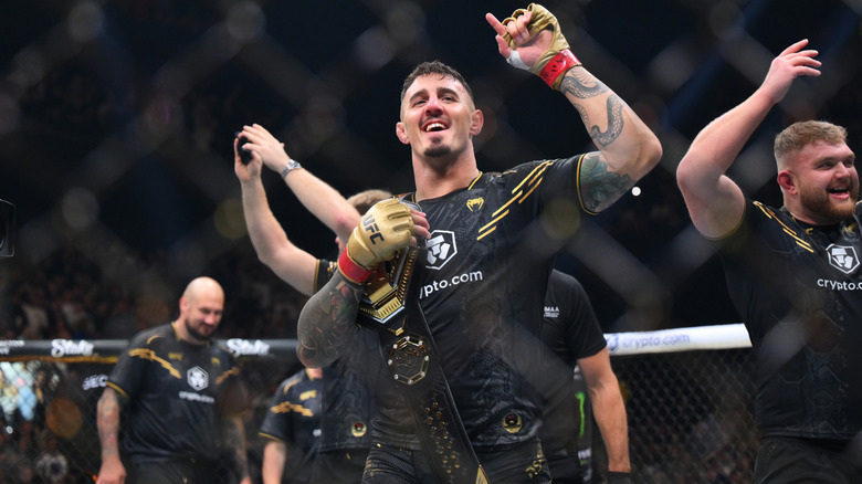 Tom Aspinall celebrates title win