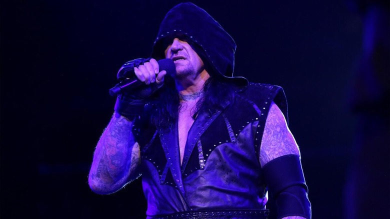 The Undertaker alongside Kane cutting a promo moments before being attacked by D-Generation X during their 2018 feud.