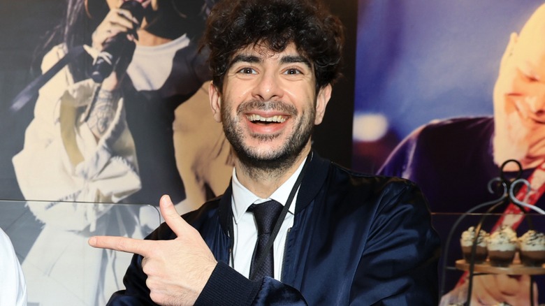 Tony Khan pointing to where you can order AEW All In