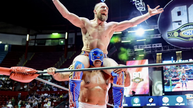 Bryan Danielson and Blue Panther celebrate together