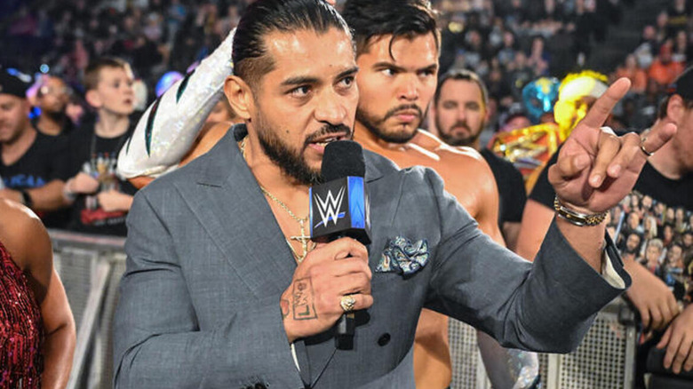 Santos Escobar speaks on the microphone.