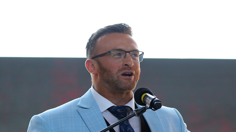 Nick Aldis talking on the mic 