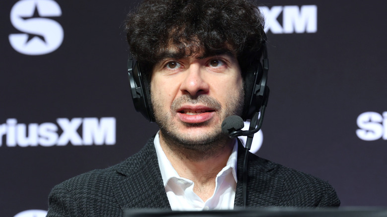 Tony Khan wearing a headset