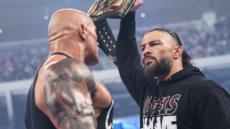 The Rock stares down Roman Reigns