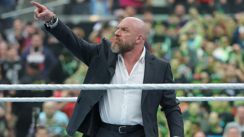 CCO of WWE, Triple H, points to the WrestleMania 41 sign (not pictured), firing up the Las Vegas crowd