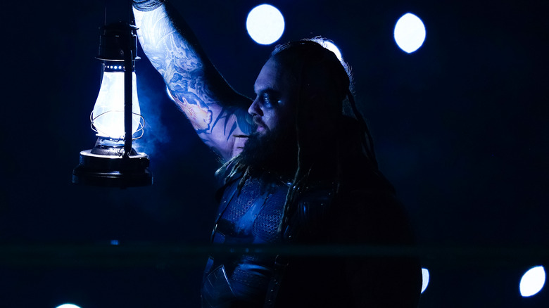 Bray Wyatt holds lamp