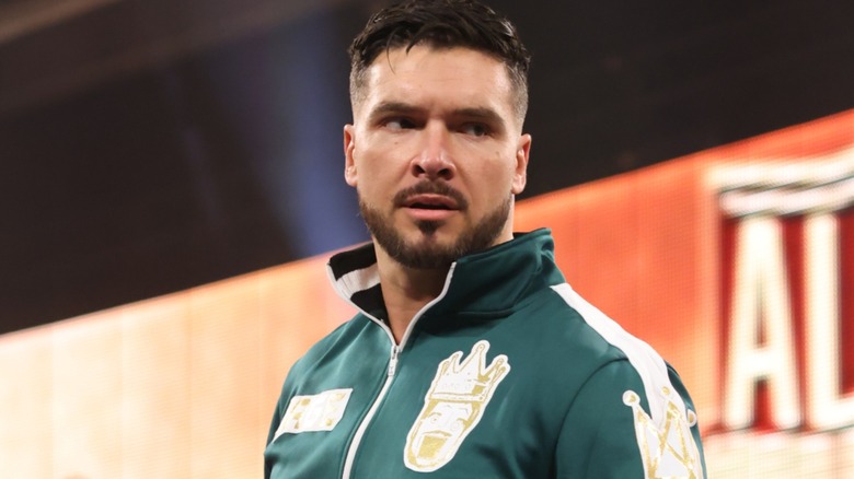 Ethan Page wearing a green jacket