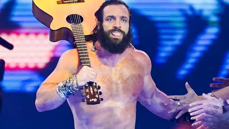 Elias makes his entrance with a guitar