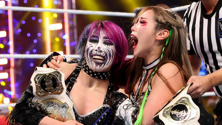 Asuka and Kairi Sane after winning the WWE Women's Tag Team Championship