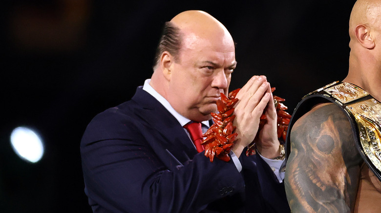 Paul Heyman, appearing to be praying