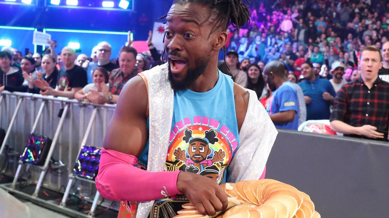 Kofi Kingston holds a plate of pancakes for his entrance.