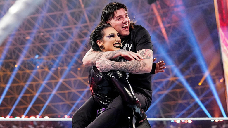 Dominik Mysterio and Rhea Ripley embracing