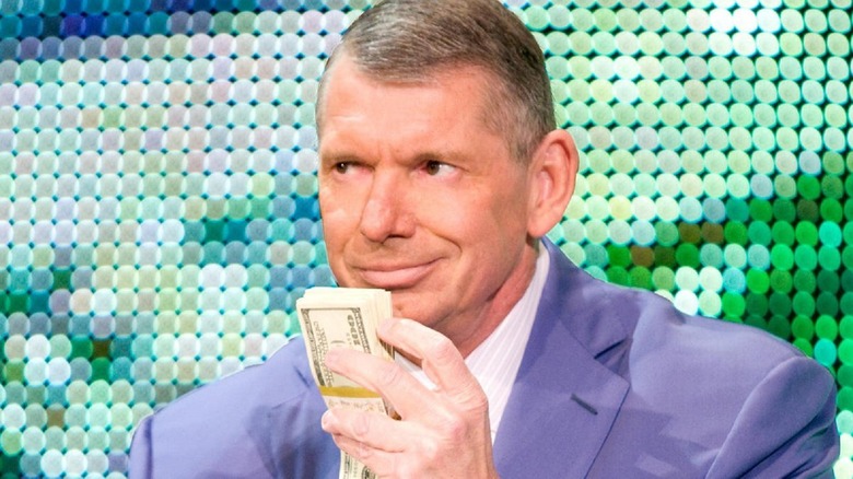 Vince McMahon with his one true love, money