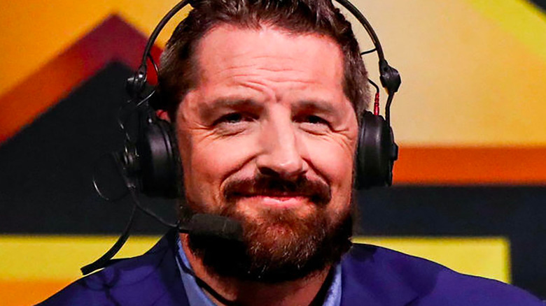 Wade Barrett with a headset on commentary