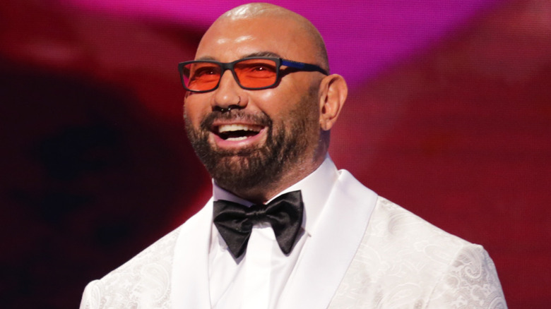 Dave Bautista in a white tuxedo