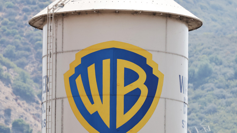 The Warner Bros. logo is displayed on a water tower at Warner Bros. Studio on September 12, 2025 in Burbank, California. Media giant Paramount Skydance is reportedly preparing a bid to purchase Warner Bros. Discovery, including its movie studio and cable networks.