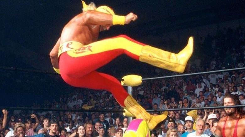 Hulk Hogan dropping a leg on Randy Savage at WCW Bash at the Beach 1996