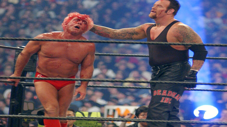 Ric Flair bleeding while wrestling The Undertaker
