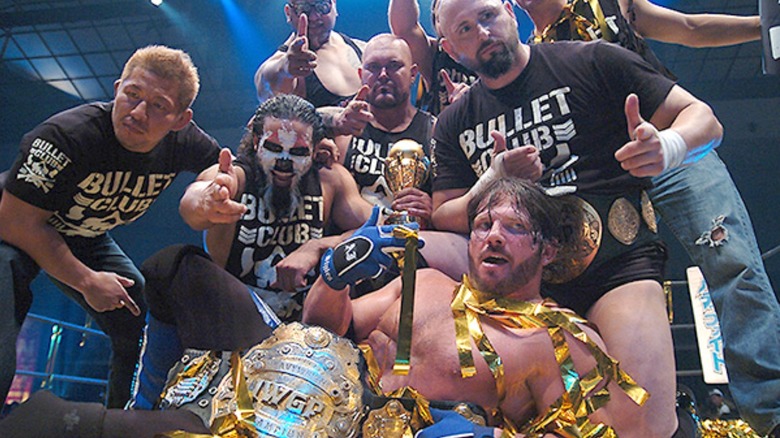 AJ Styles and Bullet Club draped in gold