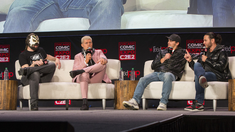 Cody Rhodes with Excalibur and the Young Bucks