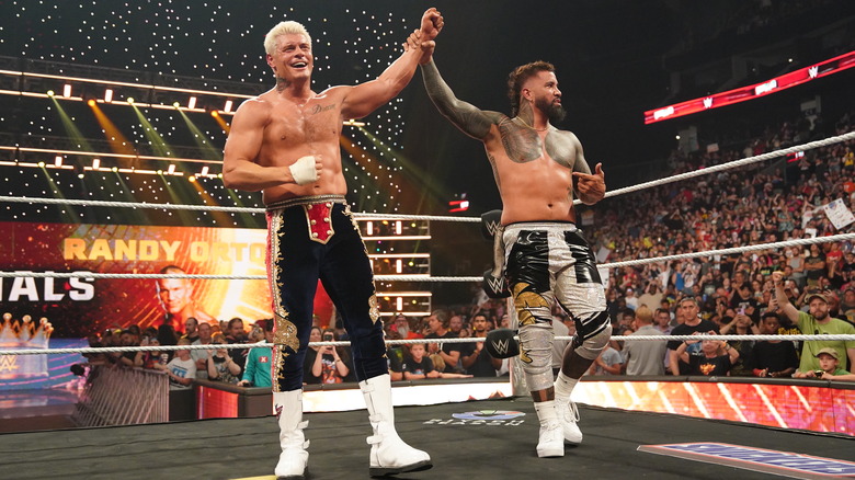Jey Uso raising Cody Rhodes' hand on "WWE Raw"