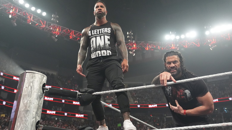 Jey Uso stands above Roman Reigns on "WWE Raw"