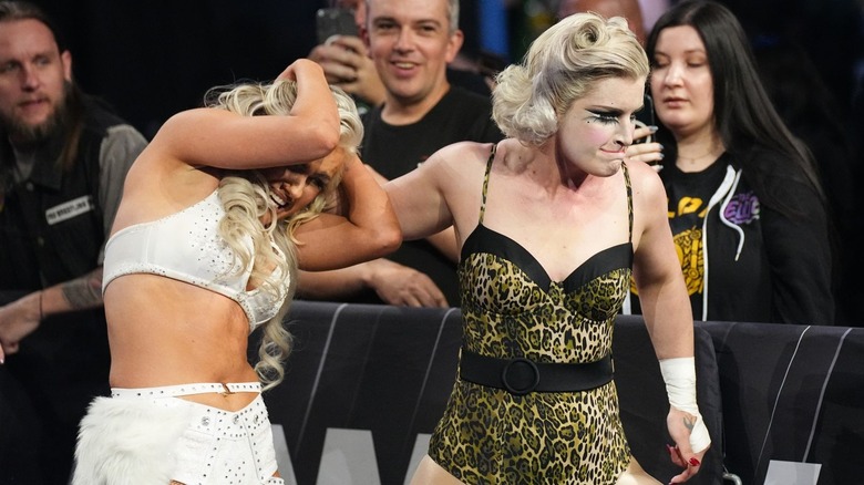 "Timeless" Toni Storm grabs Mariah May by the hair and leads her to the ring during the match at AEW Revolution.