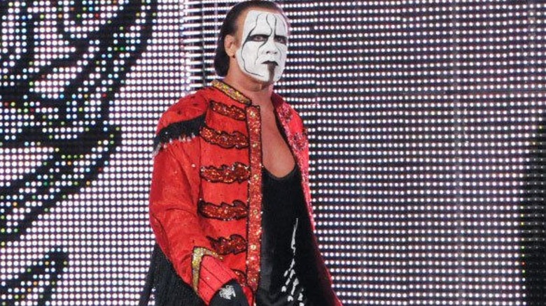 Sting heads down to the ring, wearing a red ring coat and his signature face paint, to face Seth Rollins for the WWE Championship, at Night of Champions 2015.