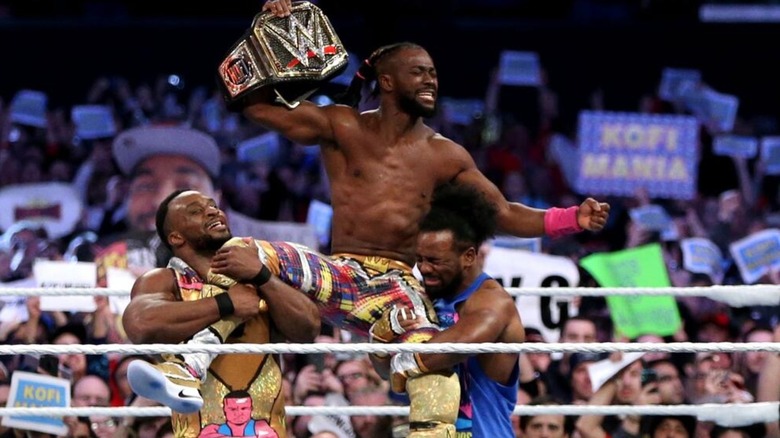 Kofi Kingston celebrates winning the WWE Championship