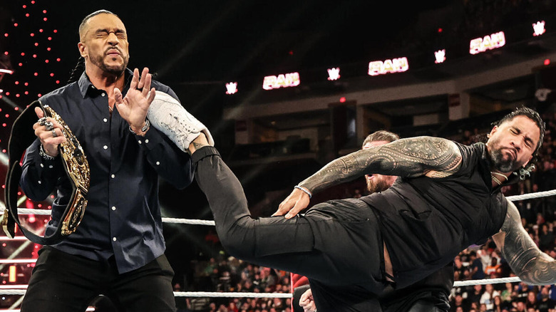 Jey Uso delivers a devastating Superkick to then-WWE World Heavyweight Champion Damian Priest.