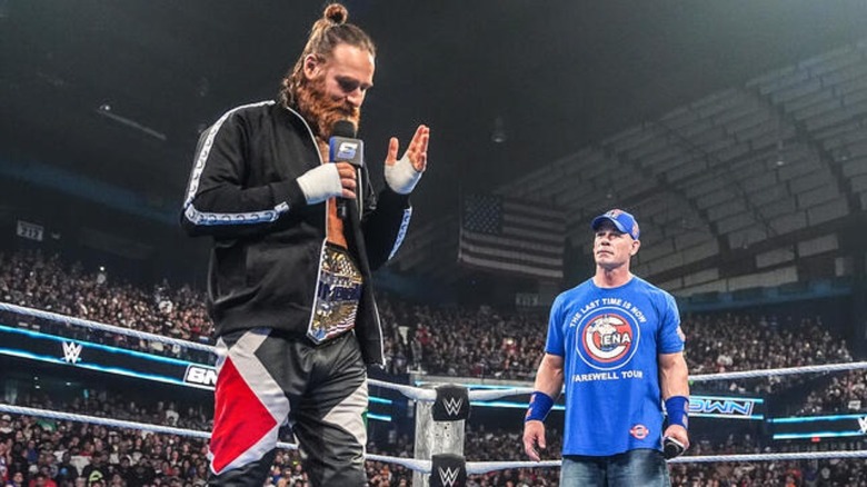 Sami Zayn and John Cena exchange words in the ring