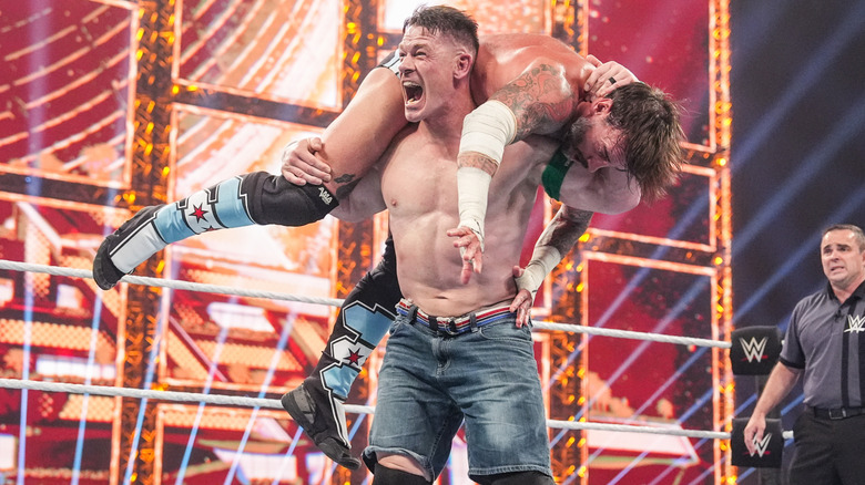 John Cena getting ready to hit CM Punk with the Attitude Adjustment