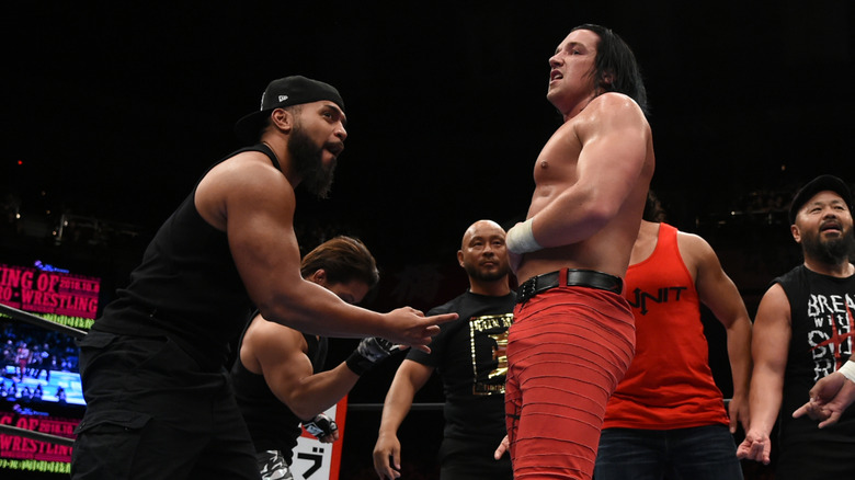 Tama Tonga and Jay White of Bullet Club, with Tonga giving the Too Sweet