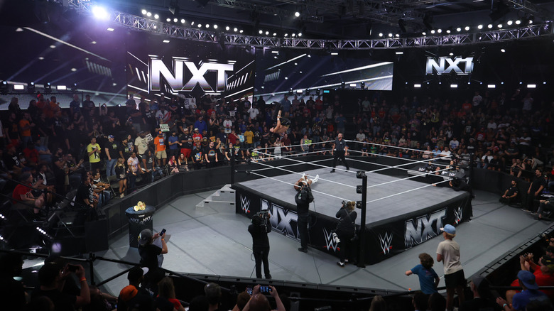 An arena scene of Mike Santana in air against Trick Williams during NXT at the WWE Performance Center on June 3, 2025 in Orlando, Florida.