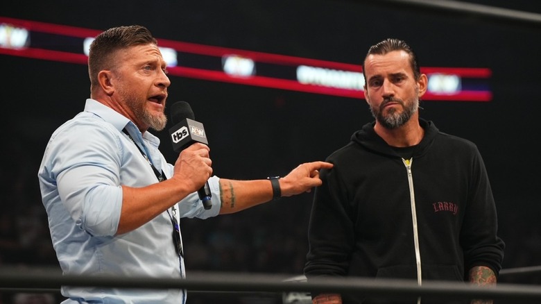Ace Steel points at CM Punk