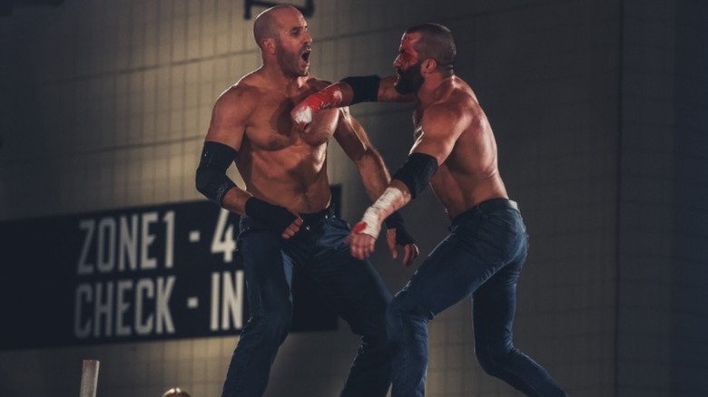 Claudio Castagnoli and Trent Beretta brawl in the parking lot